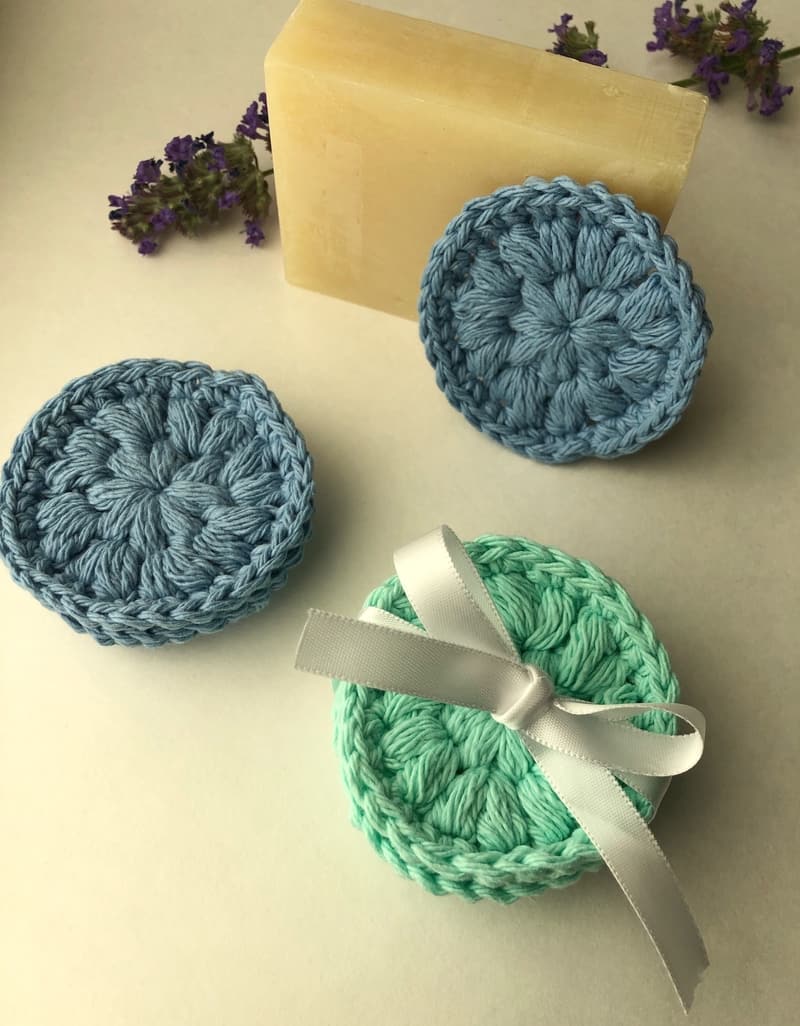 Stack of crochet face scrubbies with a gift ribbon
